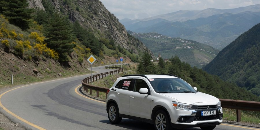 Mitsubishi ASX huurauto op een bergweg in Georgië