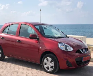 Vooraanzicht van een huurauto Nissan Micra in Paphos, Cyprus ✓ Auto #1218. ✓ Transmissie Automatisch TM ✓ 2 beoordelingen.