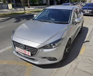 Vooraanzicht van een huurauto Mazda Axela in Limassol, Cyprus ✓ Auto #2050. ✓ Transmissie Automatisch TM ✓ 0 beoordelingen.