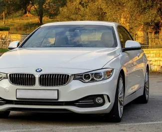 Vooraanzicht van een huurauto BMW 428i Cabrio in Becici, Montenegro ✓ Auto #2476. ✓ Transmissie Automatisch TM ✓ 0 beoordelingen.