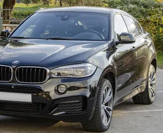 Vooraanzicht van een huurauto BMW X6 in Becici, Montenegro ✓ Auto #2492. ✓ Transmissie Automatisch TM ✓ 0 beoordelingen.