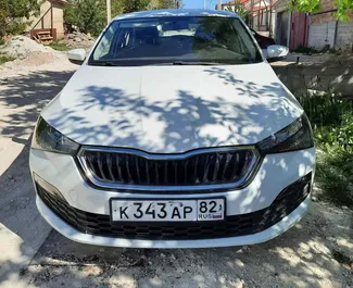 Vooraanzicht van een huurauto Skoda Rapid in Simferopol, Krim ✓ Auto #3079. ✓ Transmissie Automatisch TM ✓ 0 beoordelingen.