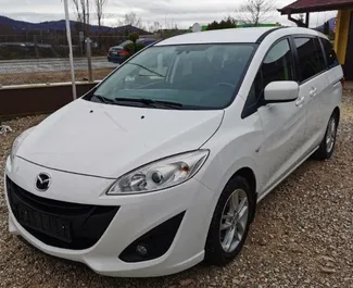 Vooraanzicht van een huurauto Mazda 5 op luchthaven Burgas, Bulgarije ✓ Auto #2872. ✓ Transmissie Automatisch TM ✓ 0 beoordelingen.