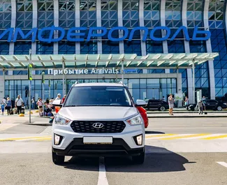 Vooraanzicht van een huurauto Hyundai Creta op de luchthaven van Simferopol, Krim ✓ Auto #2643. ✓ Transmissie Automatisch TM ✓ 0 beoordelingen.