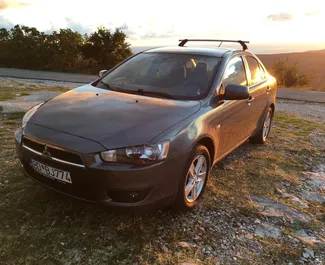 Vooraanzicht van een huurauto Mitsubishi Lancer in Budva, Montenegro ✓ Auto #3148. ✓ Transmissie Handmatig TM ✓ 0 beoordelingen.