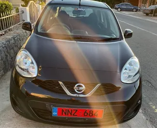 Vooraanzicht van een huurauto Nissan March in Pomos, Cyprus ✓ Auto #4000. ✓ Transmissie Automatisch TM ✓ 0 beoordelingen.