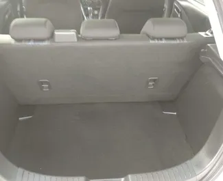 Interieur van Mazda Demio te huur in Cyprus. Een geweldige auto met 5 zitplaatsen en een Automatisch transmissie.