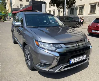 Vooraanzicht van een huurauto Mitsubishi Outlander Xl in Tbilisi, Georgië ✓ Auto #4165. ✓ Transmissie Automatisch TM ✓ 0 beoordelingen.