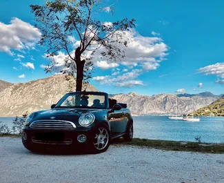 Vooraanzicht van een huurauto Mini Cooper Cabrio in Budva, Montenegro ✓ Auto #4251. ✓ Transmissie Handmatig TM ✓ 1 beoordelingen.