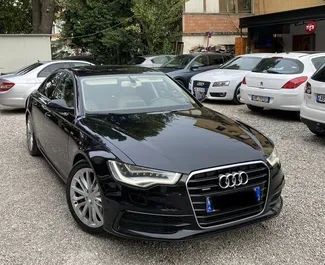 Vooraanzicht van een huurauto Audi A6 in Tirana, Albanië ✓ Auto #4589. ✓ Transmissie Automatisch TM ✓ 0 beoordelingen.