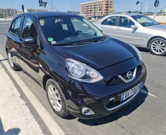 Vooraanzicht van een huurauto Nissan Micra in Tirana, Albanië ✓ Auto #4513. ✓ Transmissie Automatisch TM ✓ 0 beoordelingen.
