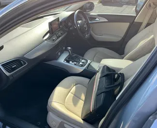 Interieur van Audi A6 te huur in Cyprus. Een geweldige auto met 5 zitplaatsen en een Automatisch transmissie.