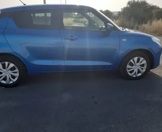 Vooraanzicht van een huurauto Suzuki Swift in Larnaca, Cyprus ✓ Auto #6511. ✓ Transmissie Automatisch TM ✓ 0 beoordelingen.