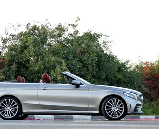 Autohuur Mercedes-Benz C300 Cabrio 2020 in in de VAE, met Benzine brandstof en 255 pk ➤ Vanaf 499 AED per dag.