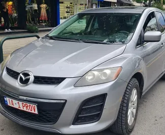 Vooraanzicht van een huurauto Mazda CX-7 in Tirana, Albanië ✓ Auto #6622. ✓ Transmissie Automatisch TM ✓ 0 beoordelingen.