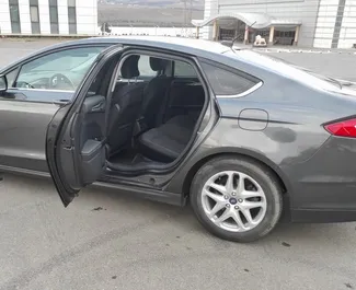 Ford Fusion Sedan 2014 beschikbaar voor verhuur in Tbilisi, met een kilometerlimiet van onbeperkt.