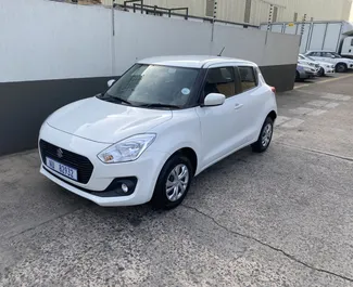 Vooraanzicht van een huurauto Suzuki Swift in Ayia Napa, Cyprus ✓ Auto #6465. ✓ Transmissie Automatisch TM ✓ 0 beoordelingen.