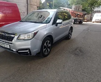 Vooraanzicht van een huurauto Subaru Forester in Tbilisi, Georgië ✓ Auto #7272. ✓ Transmissie Automatisch TM ✓ 1 beoordelingen.