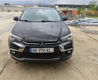 Vooraanzicht van een huurauto Mitsubishi Outlander Sport in Tbilisi, Georgië ✓ Auto #7905. ✓ Transmissie Automatisch TM ✓ 0 beoordelingen.