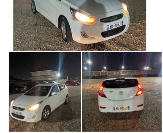 Vooraanzicht van een huurauto Hyundai Accent op de luchthaven van Tirana, Albanië ✓ Auto #7686. ✓ Transmissie Automatisch TM ✓ 0 beoordelingen.