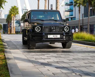 Vooraanzicht van een huurauto Mercedes-Benz G63 AMG in Dubai, Verenigde Arabische Emiraten ✓ Auto #8399. ✓ Transmissie Automatisch TM ✓ 0 beoordelingen.