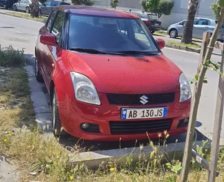 Vooraanzicht van een huurauto Suzuki Swift in Durrës, Albanië ✓ Auto #8608. ✓ Transmissie Handmatig TM ✓ 0 beoordelingen.