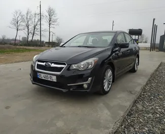 Vooraanzicht van een huurauto Subaru Impreza op de luchthaven van Koetaisi, Georgië ✓ Auto #9231. ✓ Transmissie Automatisch TM ✓ 0 beoordelingen.