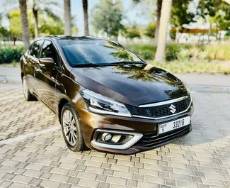 Vooraanzicht van een huurauto Suzuki Ciaz Luchthaven Dubai Al Maktoum, Verenigde Arabische Emiraten ✓ Auto #9130. ✓ Transmissie Automatisch TM ✓ 0 beoordelingen.