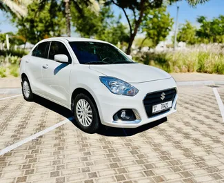 Vooraanzicht van een huurauto Suzuki Dzire Luchthaven Dubai Al Maktoum, Verenigde Arabische Emiraten ✓ Auto #9131. ✓ Transmissie Automatisch TM ✓ 0 beoordelingen.