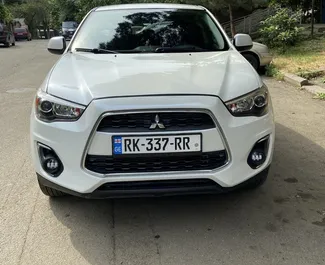 Vooraanzicht van een huurauto Mitsubishi Outlander Sport in Tbilisi, Georgië ✓ Auto #8690. ✓ Transmissie Automatisch TM ✓ 0 beoordelingen.