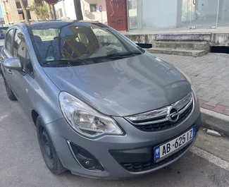 Vooraanzicht van een huurauto Opel Corsa op de luchthaven van Tirana, Albanië ✓ Auto #9416. ✓ Transmissie Handmatig TM ✓ 0 beoordelingen.