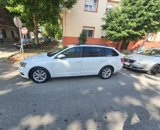 Vooraanzicht van een huurauto Skoda Octavia Combi in Podgorica, Montenegro ✓ Auto #9027. ✓ Transmissie Automatisch TM ✓ 0 beoordelingen.