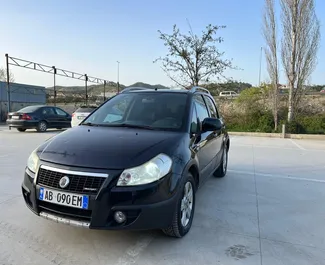 Vooraanzicht van een huurauto Fiat Sedici in Tirana, Albanië ✓ Auto #9999. ✓ Transmissie Handmatig TM ✓ 0 beoordelingen.