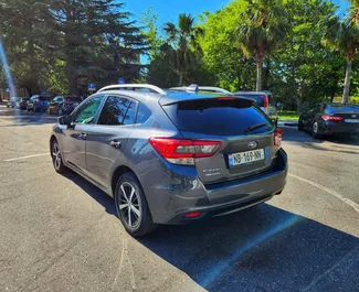 Interieur van Subaru Impreza te huur in Georgië. Een geweldige auto met 5 zitplaatsen en een Automatisch transmissie.