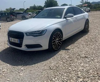 Vooraanzicht van een huurauto Audi A6 op de luchthaven van Tirana, Albanië ✓ Auto #10515. ✓ Transmissie Automatisch TM ✓ 0 beoordelingen.