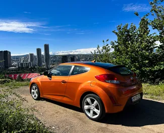 Vooraanzicht van een huurauto Hyundai Veloster in Koetaisi, Georgië ✓ Auto #10800. ✓ Transmissie Automatisch TM ✓ 0 beoordelingen.