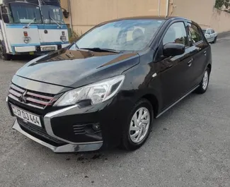 Vooraanzicht van een huurauto Mitsubishi Mirage in Jerevan, Armenië ✓ Auto #10717. ✓ Transmissie Automatisch TM ✓ 0 beoordelingen.