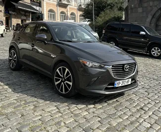 Vooraanzicht van een huurauto Mazda CX-3 in Tbilisi, Georgië ✓ Auto #10491. ✓ Transmissie Automatisch TM ✓ 0 beoordelingen.