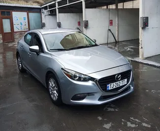 Vooraanzicht van een huurauto Mazda 3 in Tbilisi, Georgië ✓ Auto #11093. ✓ Transmissie Automatisch TM ✓ 0 beoordelingen.