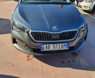 Vooraanzicht van een huurauto Skoda Scala op de luchthaven van Tirana, Albanië ✓ Auto #11495. ✓ Transmissie Automatisch TM ✓ 0 beoordelingen.