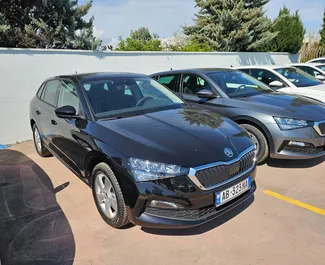 Vooraanzicht van een huurauto Skoda Scala op de luchthaven van Tirana, Albanië ✓ Auto #11514. ✓ Transmissie Automatisch TM ✓ 0 beoordelingen.