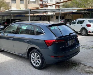 Vooraanzicht van een huurauto Skoda Scala op de luchthaven van Tirana, Albanië ✓ Auto #11496. ✓ Transmissie Automatisch TM ✓ 0 beoordelingen.