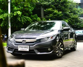 Vooraanzicht van een huurauto Honda Civic op luchthaven Bangkok Don Muang, Thailand ✓ Auto #11827. ✓ Transmissie Automatisch TM ✓ 0 beoordelingen.