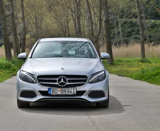 Vooraanzicht van een huurauto Mercedes-Benz C-Class AMG in Becici, Montenegro ✓ Auto #12156. ✓ Transmissie Automatisch TM ✓ 0 beoordelingen.