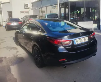 Interieur van Mazda 6 te huur in Georgië. Een geweldige auto met 5 zitplaatsen en een Automatisch transmissie.