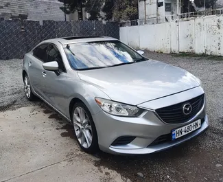 Vooraanzicht van een huurauto Mazda 6 in Tbilisi, Georgië ✓ Auto #12499. ✓ Transmissie Automatisch TM ✓ 0 beoordelingen.