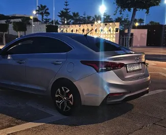 Vooraanzicht van een huurauto Hyundai Accent Blue op de luchthaven van Casablanca, Marokko ✓ Auto #10939. ✓ Transmissie Automatisch TM ✓ 0 beoordelingen.