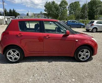Suzuki Swift 2009 beschikbaar voor verhuur op de luchthaven van Tirana, met een kilometerlimiet van onbeperkt.