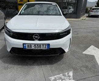 Vooraanzicht van een huurauto Opel Corsa op de luchthaven van Tirana, Albanië ✓ Auto #13542. ✓ Transmissie Automatisch TM ✓ 0 beoordelingen.