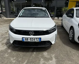 Vooraanzicht van een huurauto Opel Corsa op de luchthaven van Tirana, Albanië ✓ Auto #13540. ✓ Transmissie Handmatig TM ✓ 0 beoordelingen.